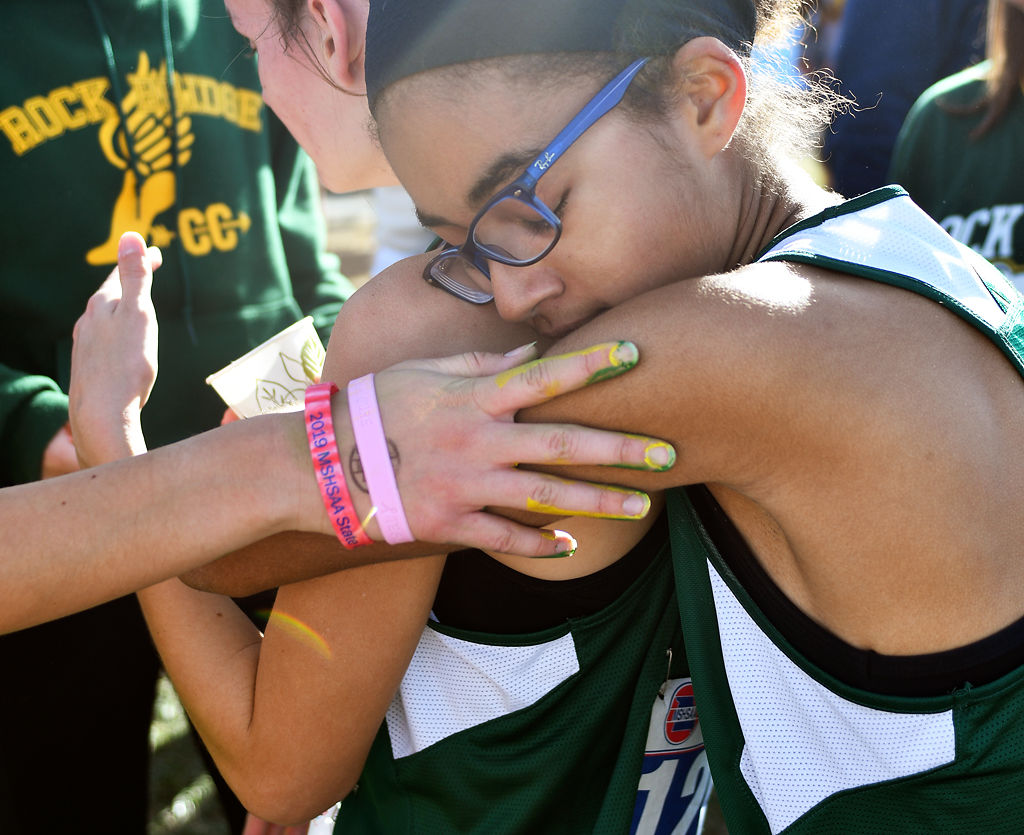 Carolyn Ford hugs her teammate Brooke Walker